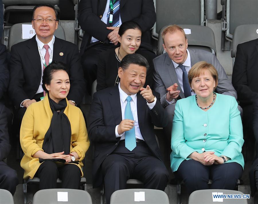 Xi, Merkel watch friendly football match between Chinese, German youth teams