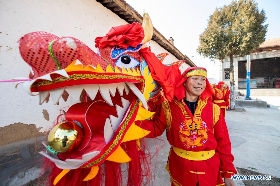 Villagers rehearse dragon and lion dance in Andi Village, Shanxi