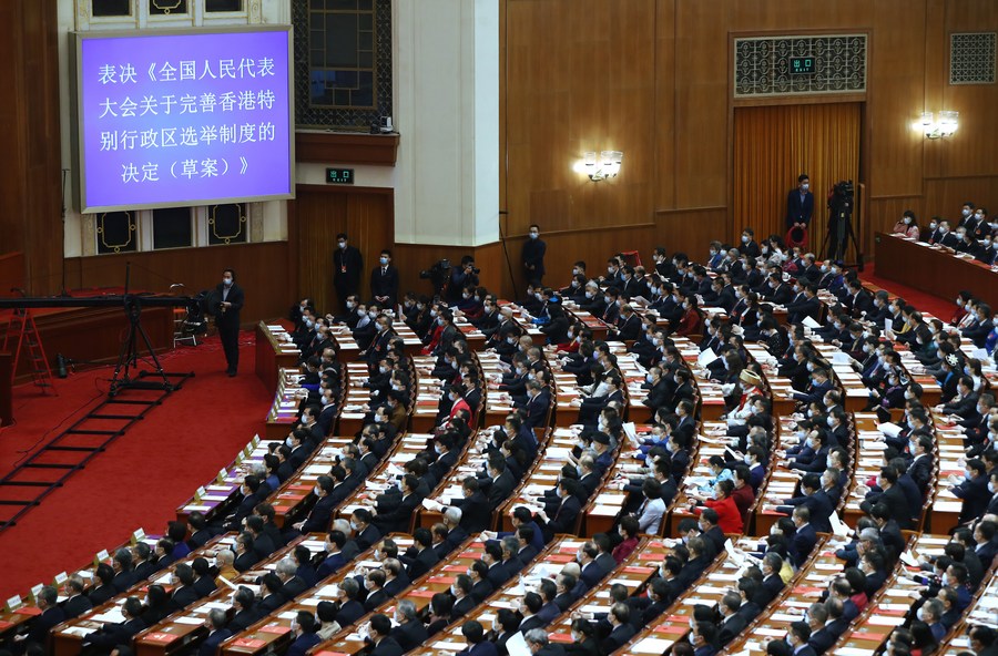 China adopts decision to improve Hong Kong electoral system