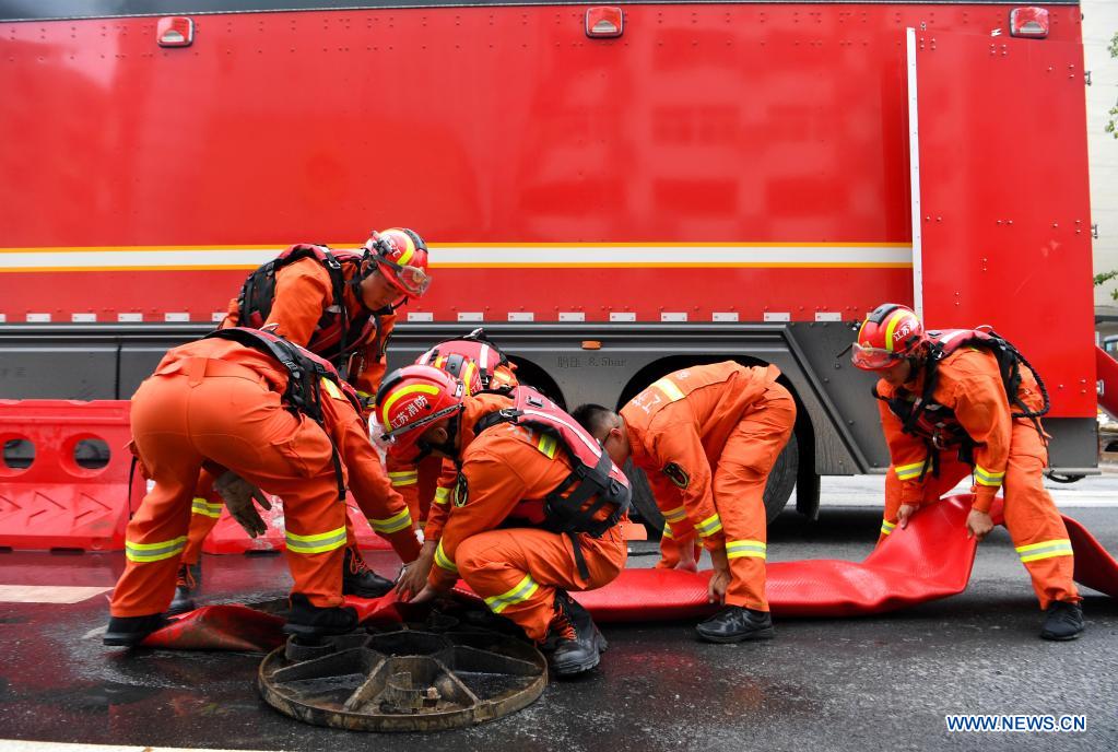 Rescue team of 1,800 firefighters deployed to flood-hit Henan from 7 neighboring provinces