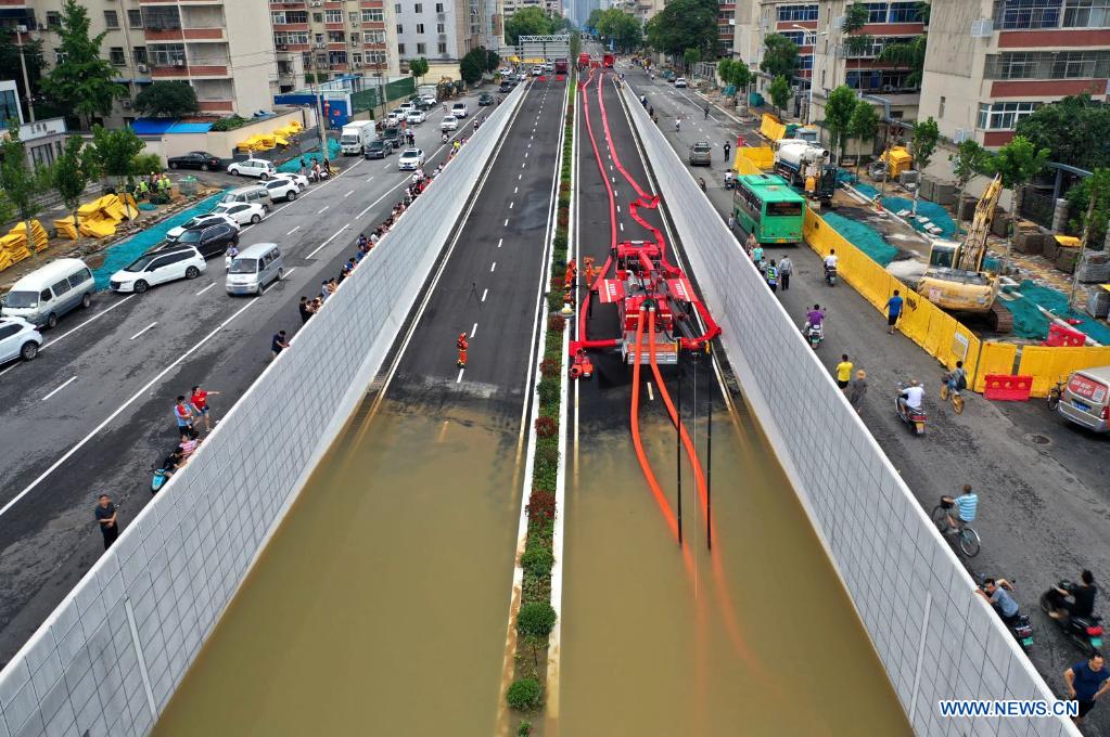 Rescue team of 1,800 firefighters deployed to flood-hit Henan from 7 neighboring provinces