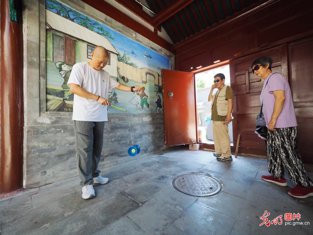 Visitors explore the Beijing Diabolo Museum during summer vacation