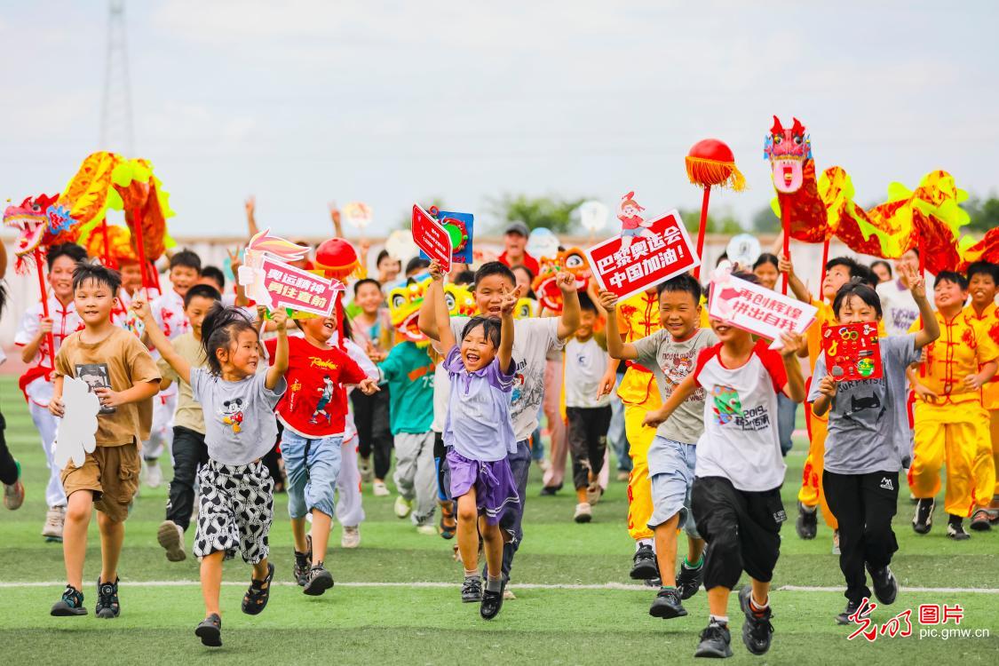 Caring for left-behind children: celebrating the Olympic event together