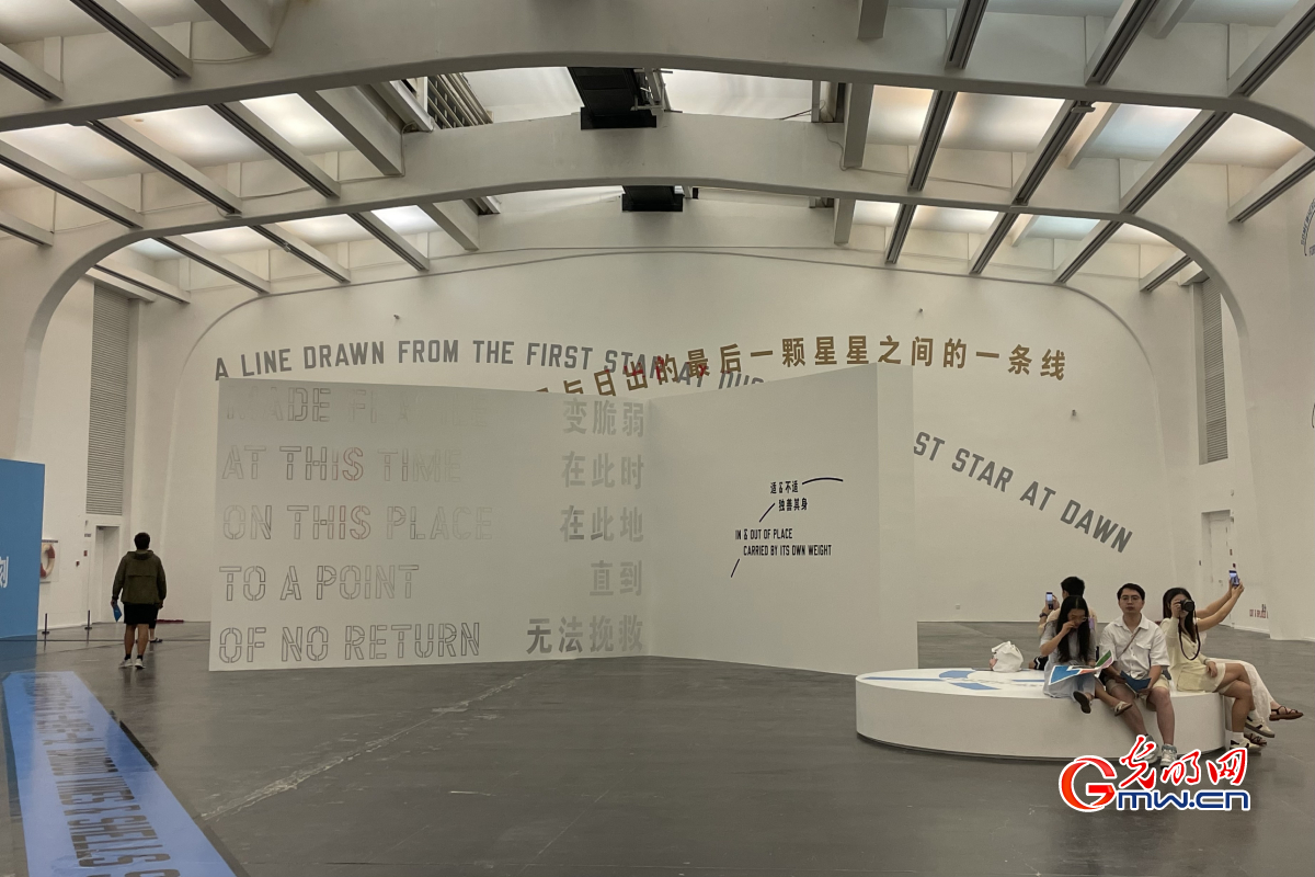 People visiting exhibition themed with pursuit of happiness on Chinese Valentine's Day