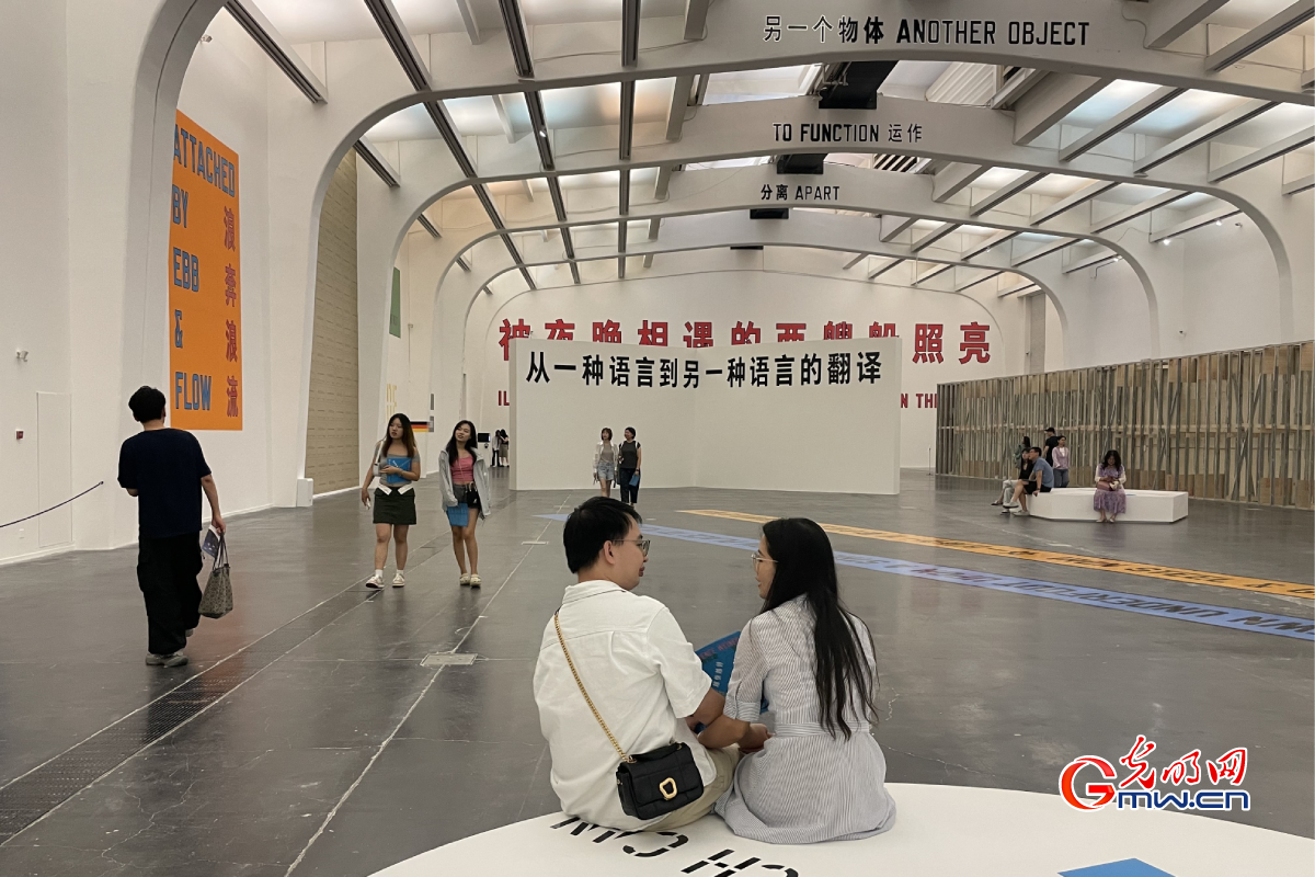 People visiting exhibition themed with pursuit of happiness on Chinese Valentine's Day