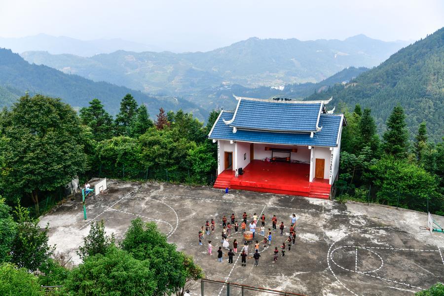 Teacher delivers hope to children in China's landlocked mountains