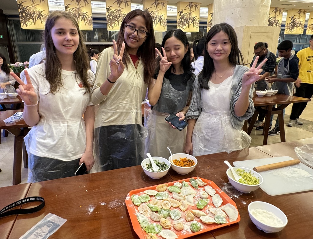 Junior Cultural Ambassadors make dumplings together.