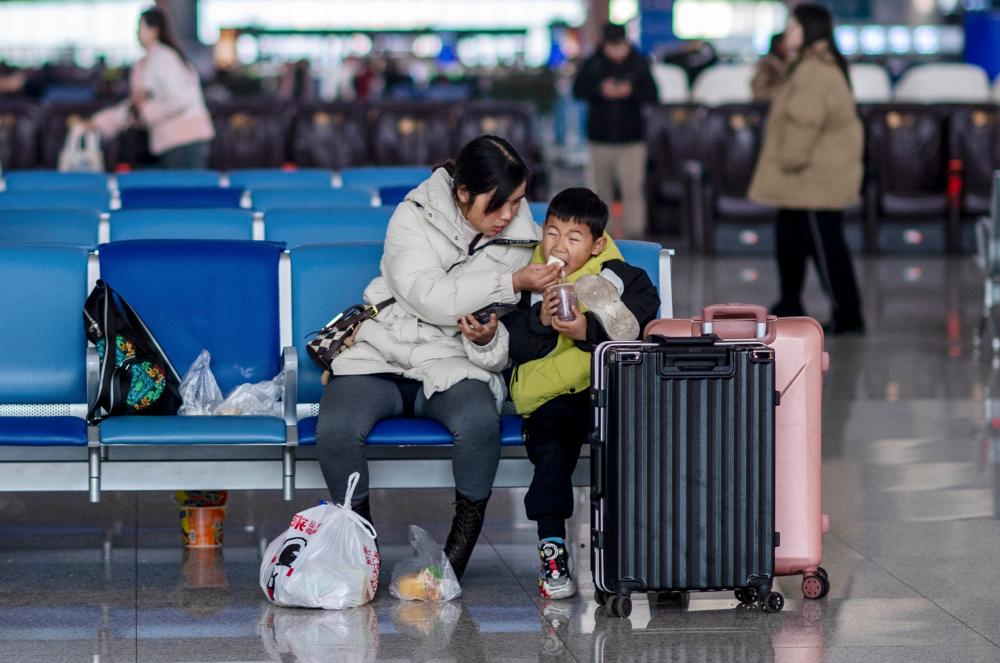 InPics: China's Spring Festival travel rush highlights more than speed and efficiency