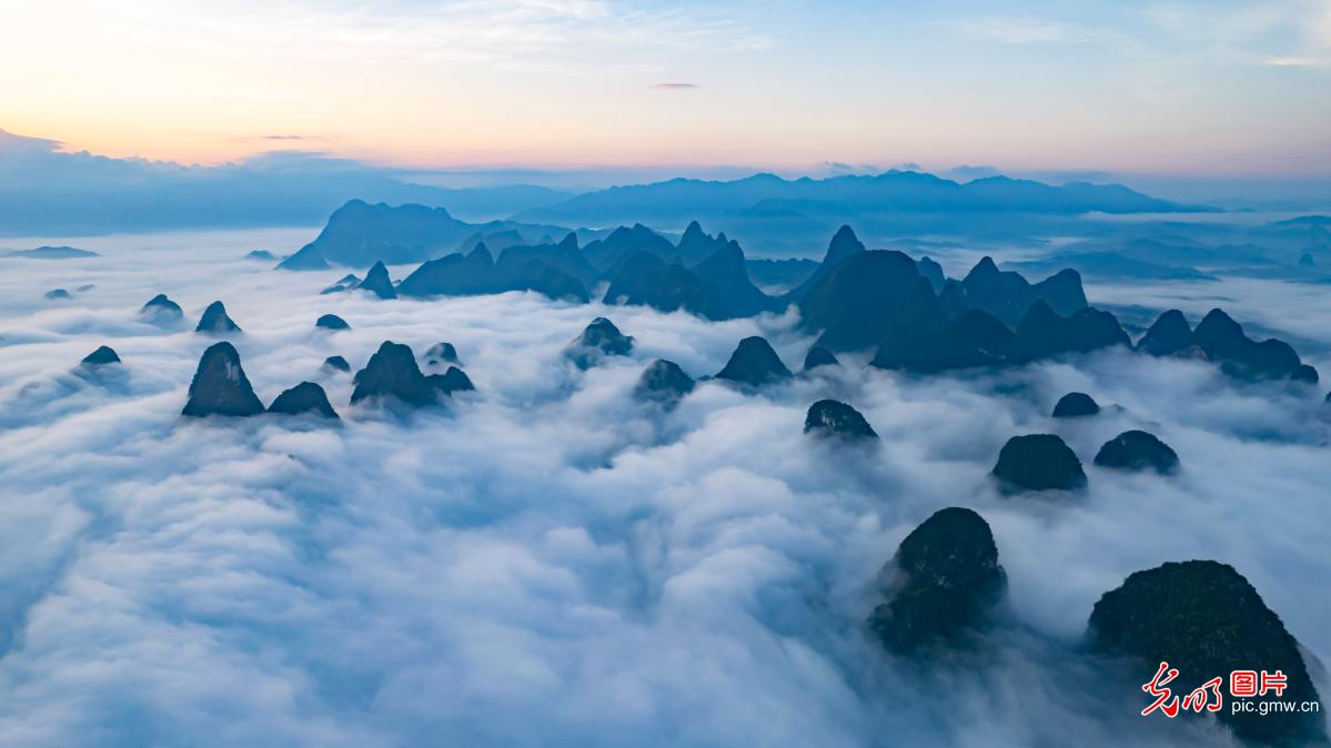 Morning light and mist create picturesque landscape in S China's Guangxi