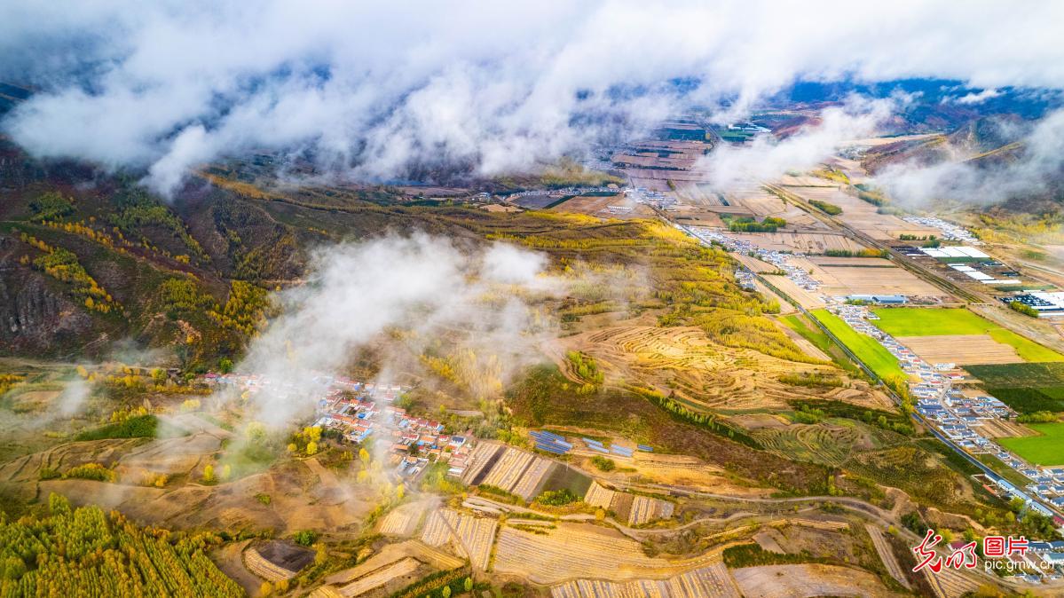 Mist-shrouded autumn mountains in N China's Hebei