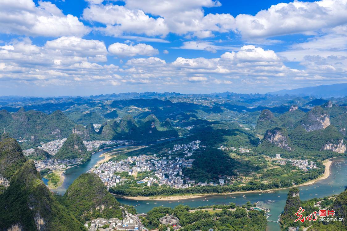 Electric rafts ply scenic Lijiang River during holiday