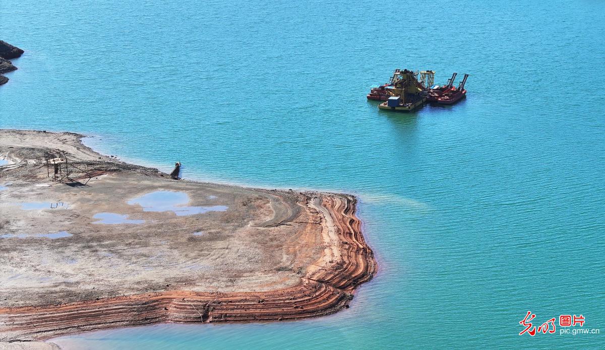 Mirror-like reservoir meets vibrant autumn tones