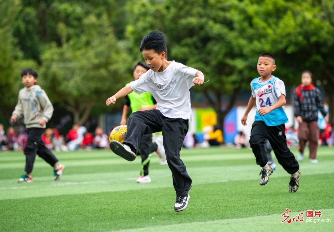 Young players practice football in SW China's Guizhou Young players practice football in SW China's Guizhou
