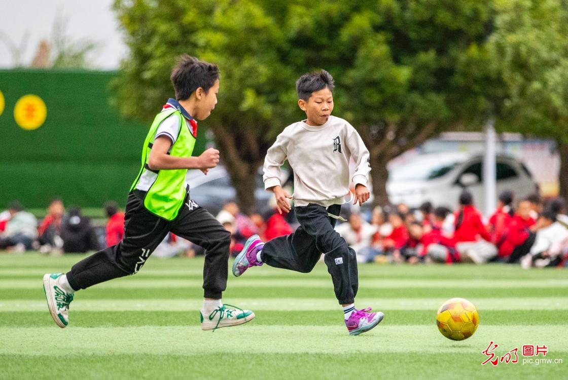 Young players practice football in SW China's Guizhou Young players practice football in SW China's Guizhou