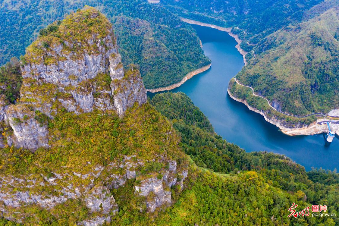Reservoir mirrors autumn hues in Central China's Hunan