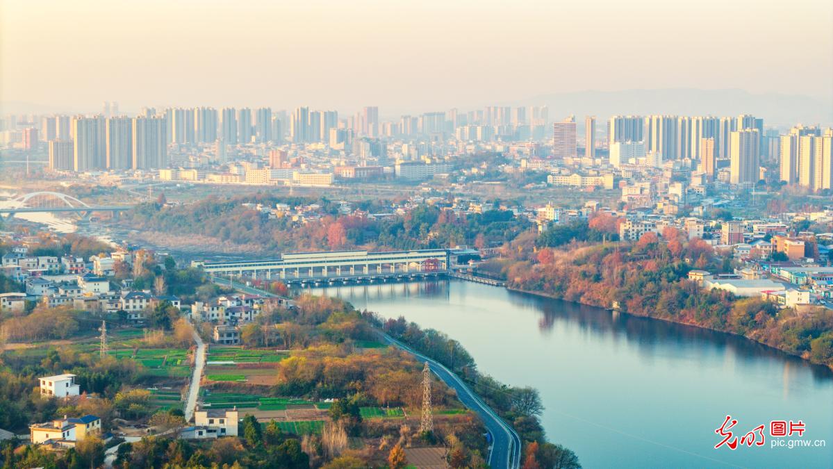 Sunlit river banks in C China's Hubei