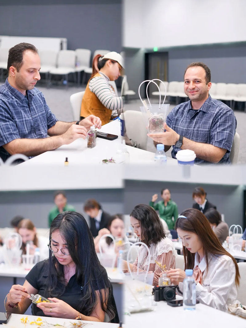 Foreigners experience floating flower scented bottle DIY in Longgang, SE China's Shenzhen
