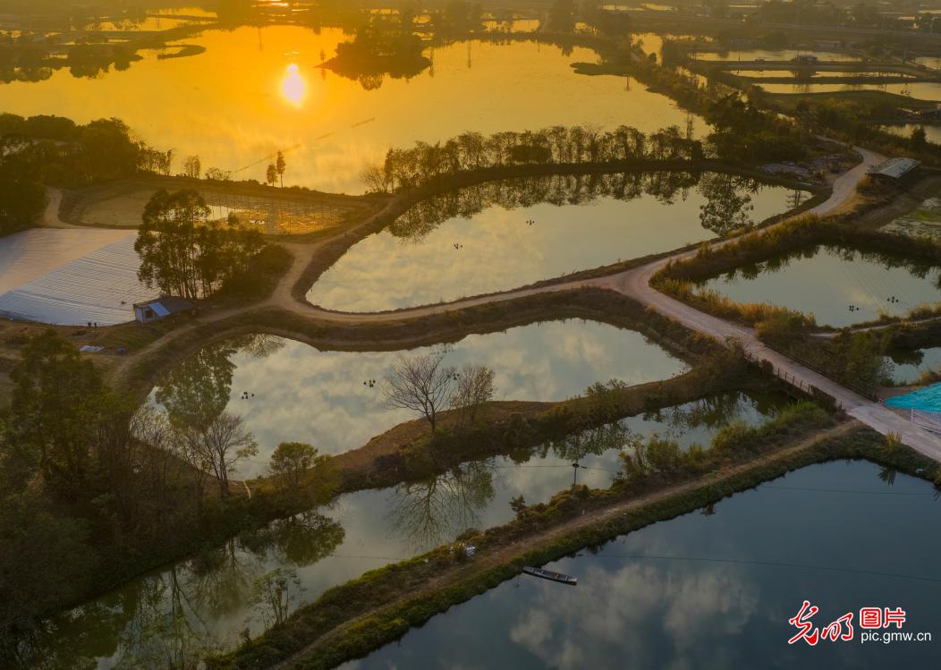 Sunset paints Gulao Water Town in south China's Guangdong