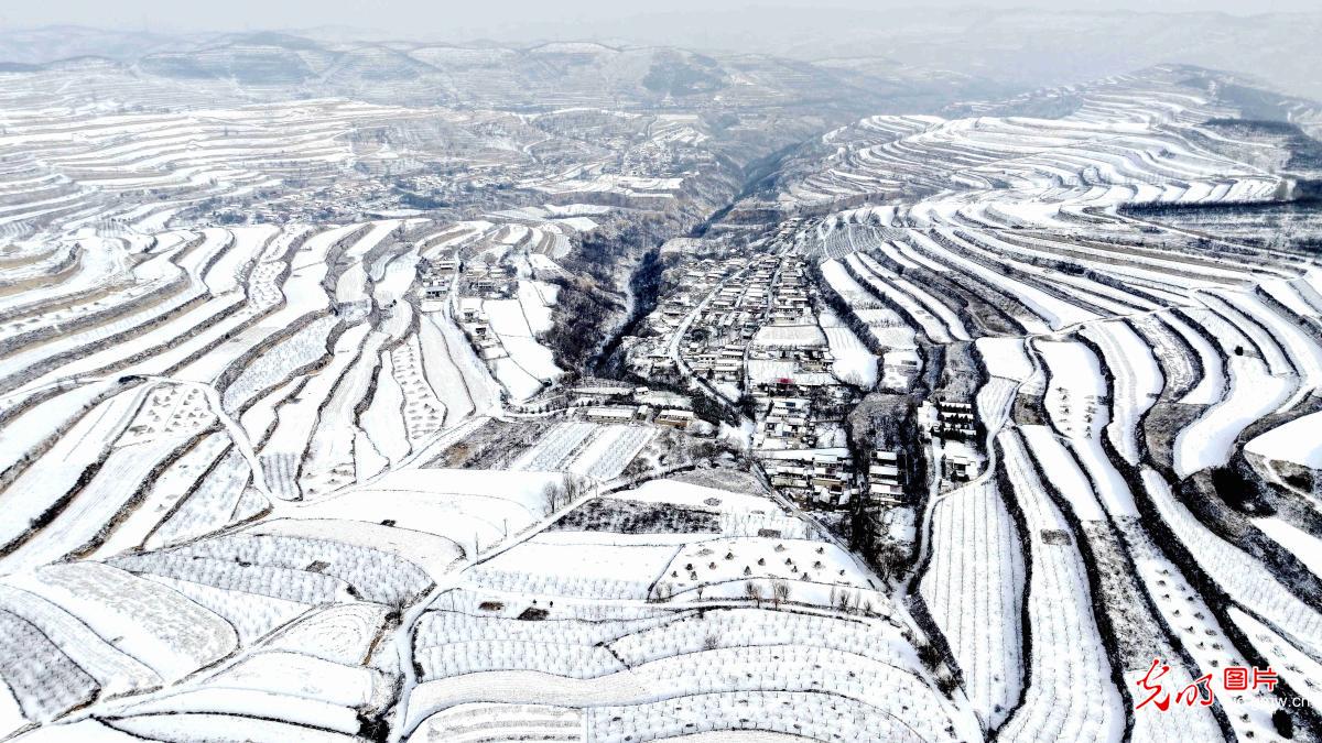 Snow-covered terraced fields in NW China's Gansu