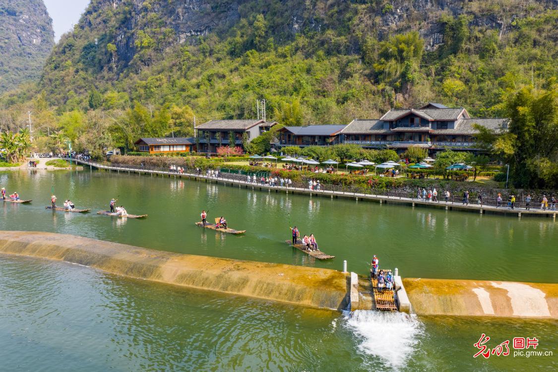 Students hike along Yulong River of S China's Guangxi
