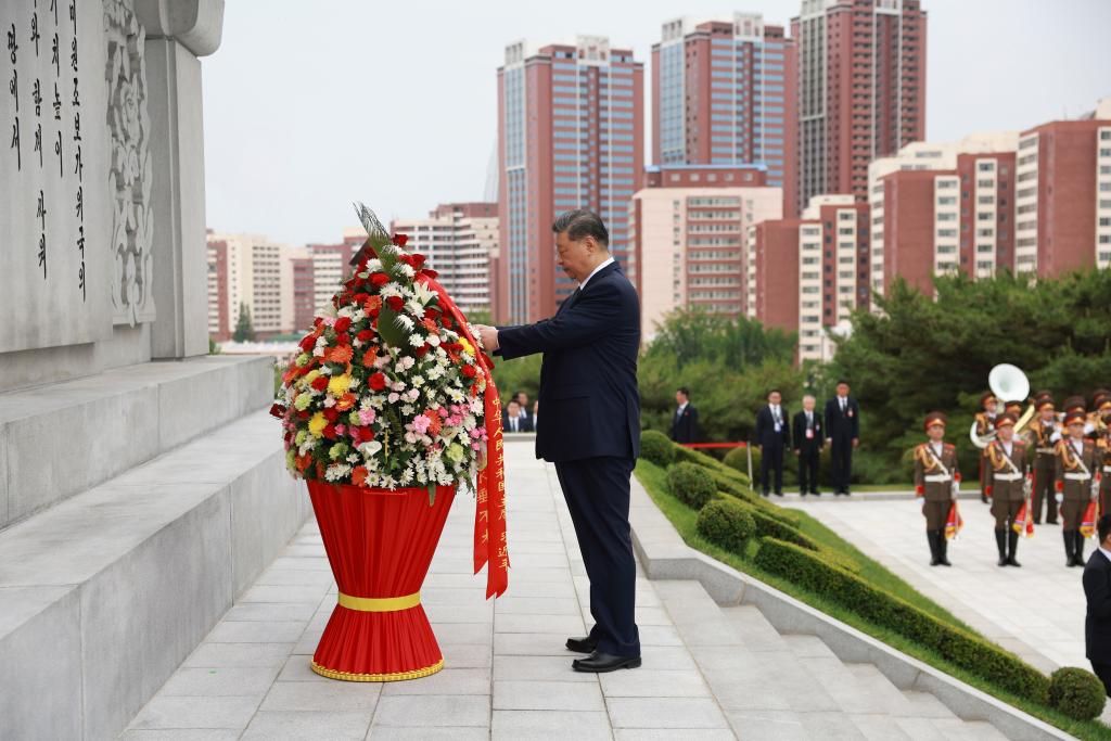 Xi, Kim pledge to carry forward great traditional China-DPRK friendship through generations