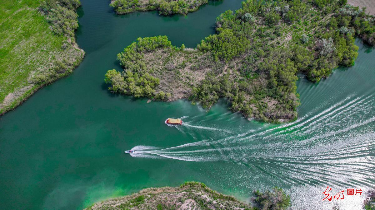 Boat tour on Kezijar Lake Scenic Area in NW China's Xinjiang