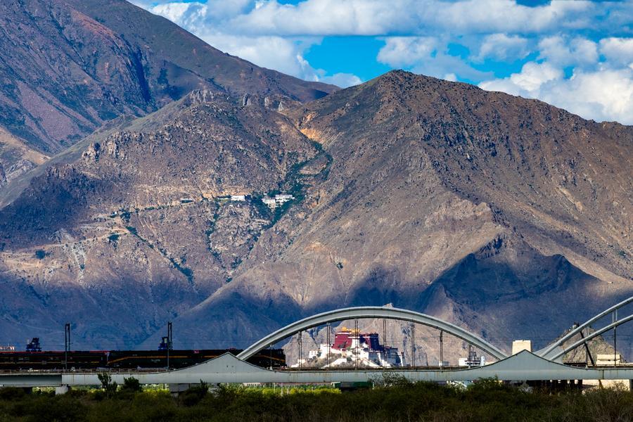 Qinghai-Xizang Railway pictured against the Potala Palace in SW China's Lhasa