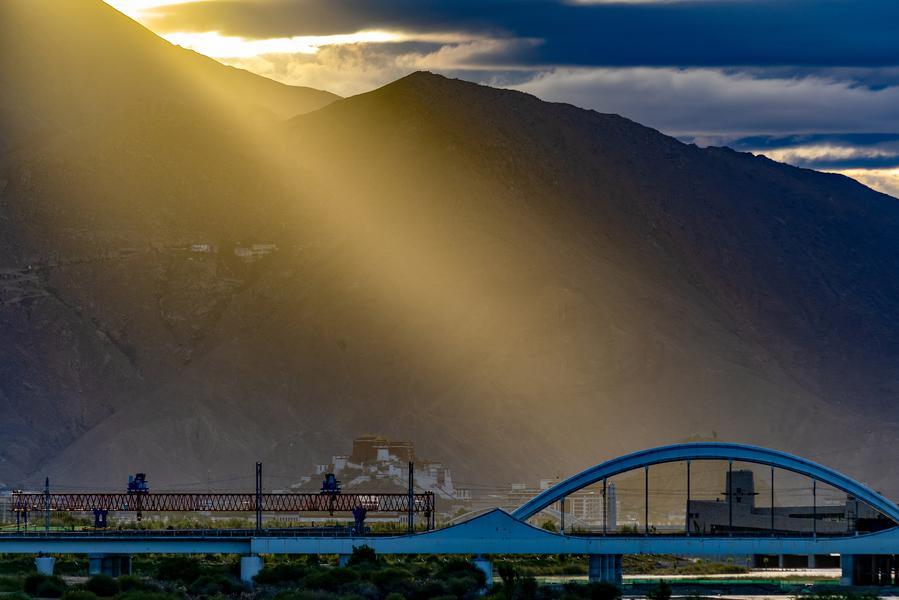 Qinghai-Xizang Railway pictured against the Potala Palace in SW China's Lhasa