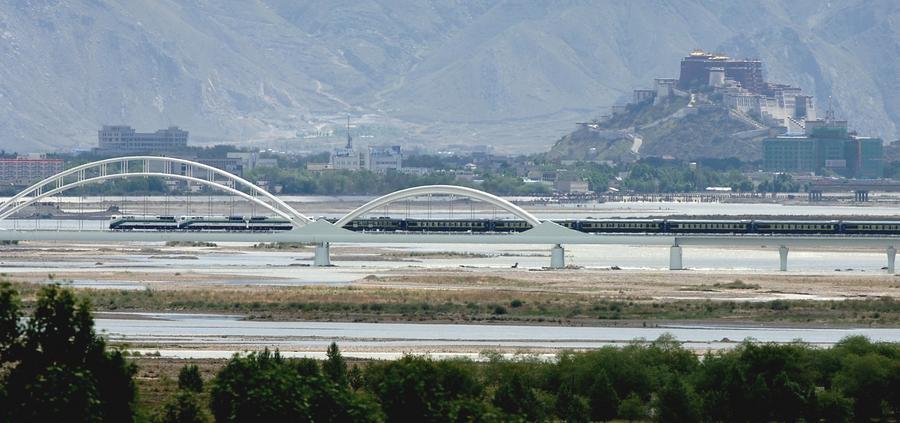 Qinghai-Xizang Railway pictured against the Potala Palace in SW China's Lhasa