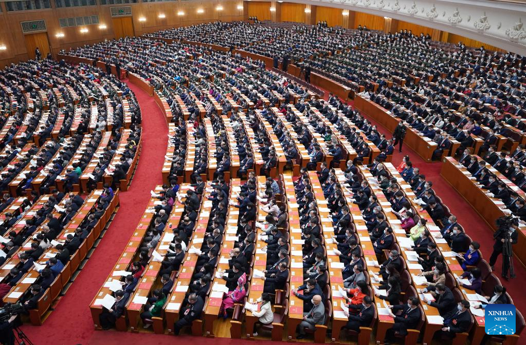 China's national legislature holds closing meeting of annual session