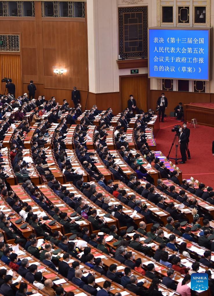 China's national legislature holds closing meeting of annual session