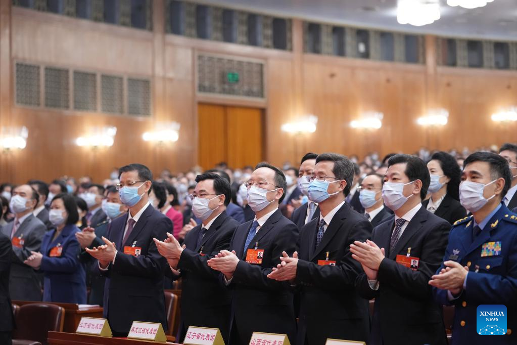 China's national legislature holds closing meeting of annual session