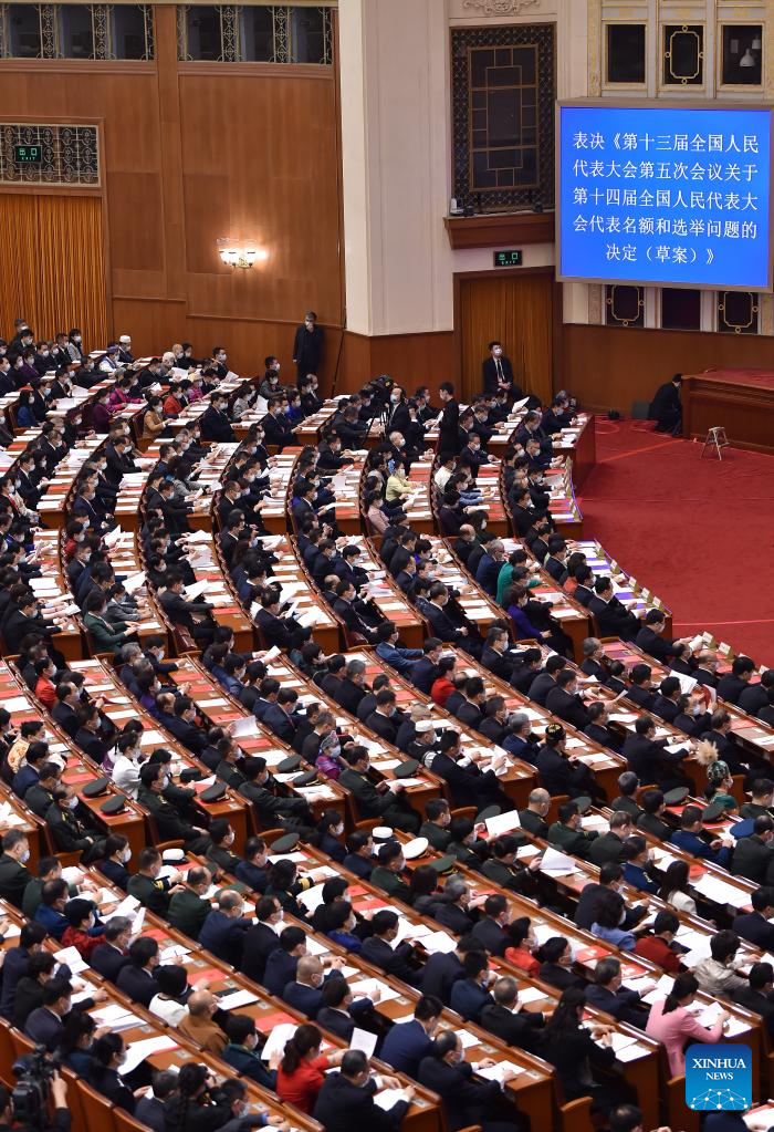 China's national legislature holds closing meeting of annual session