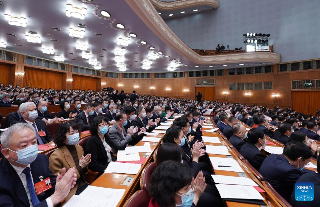 China's national legislature holds closing meeting of annual session