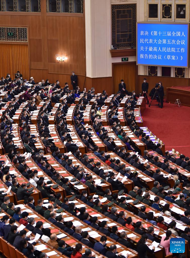 China's national legislature holds closing meeting of annual session