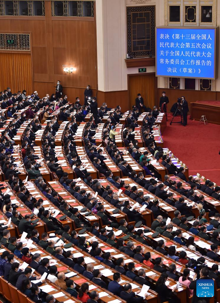 China's national legislature holds closing meeting of annual session