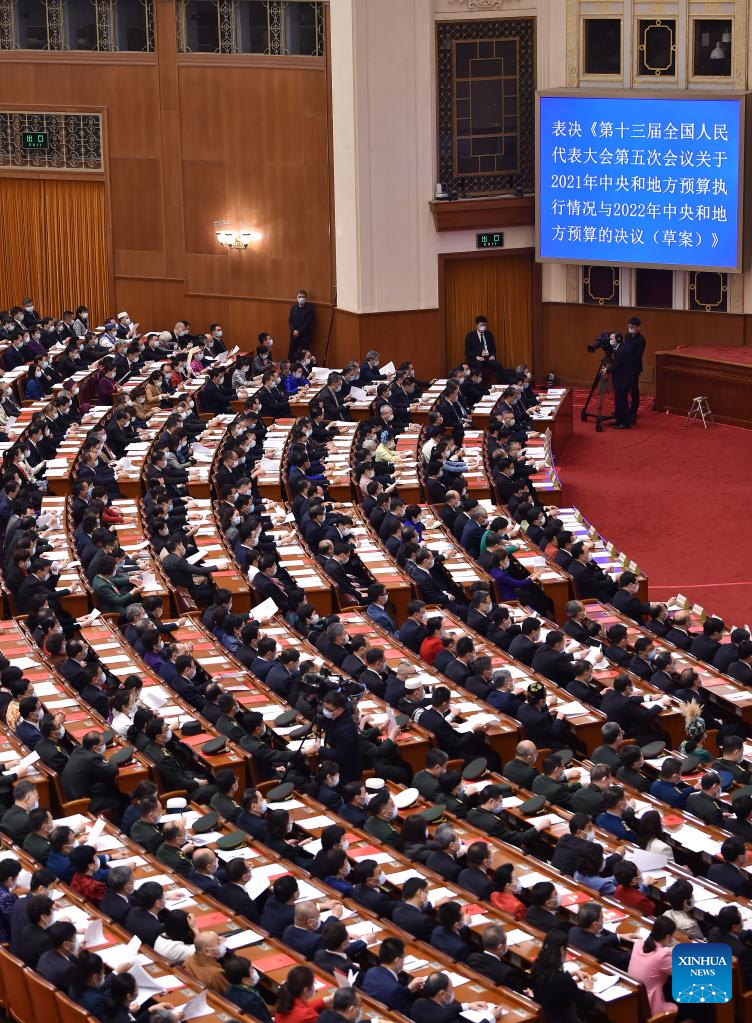 China's national legislature holds closing meeting of annual session