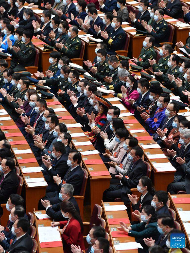 China's national legislature holds closing meeting of annual session