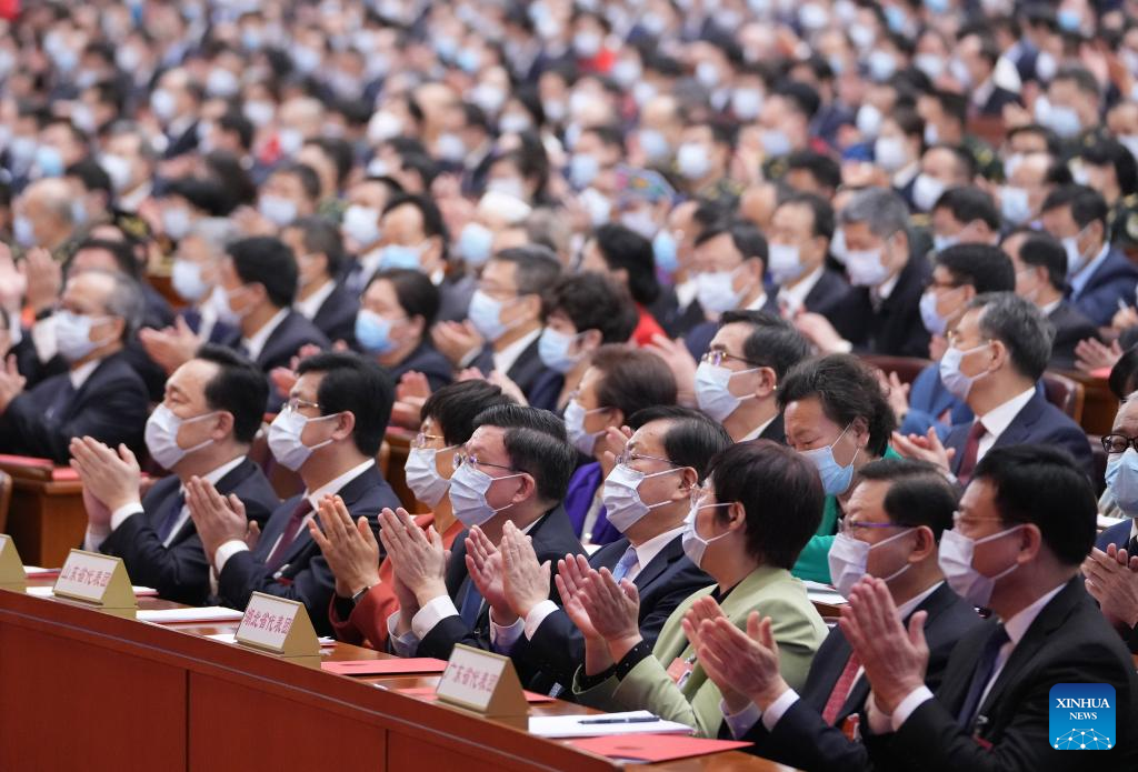 China's national legislature holds closing meeting of annual session