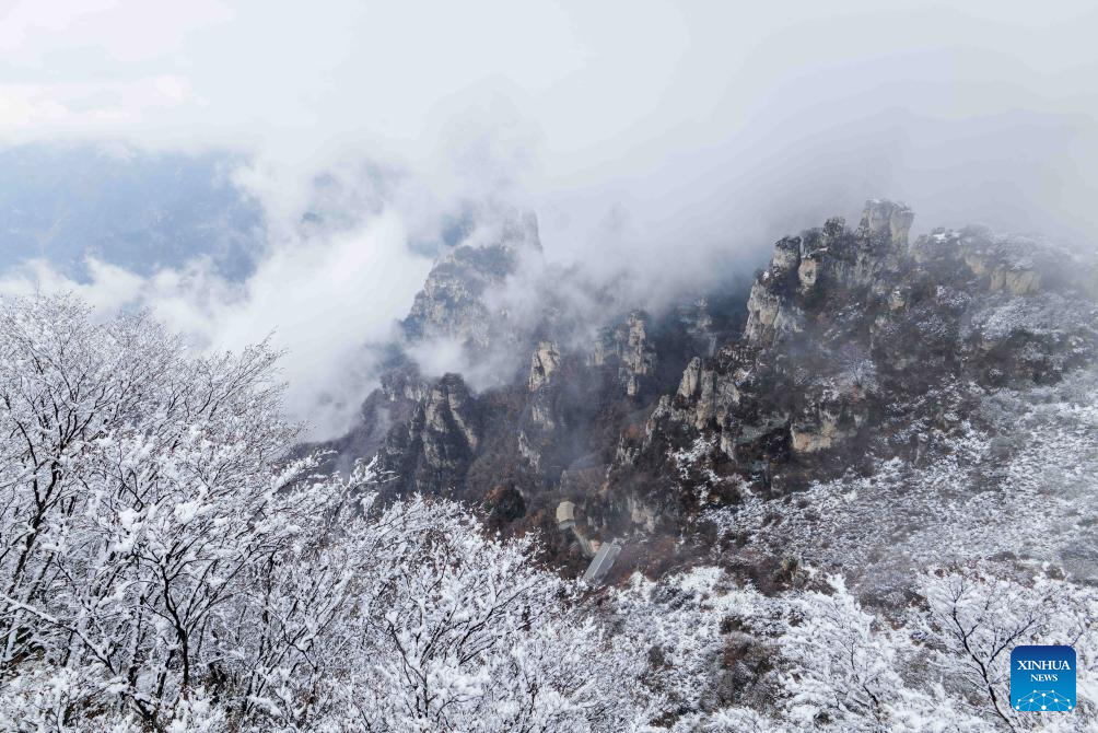 Baishi Mountain covered in snow in Laiyuan County, N China