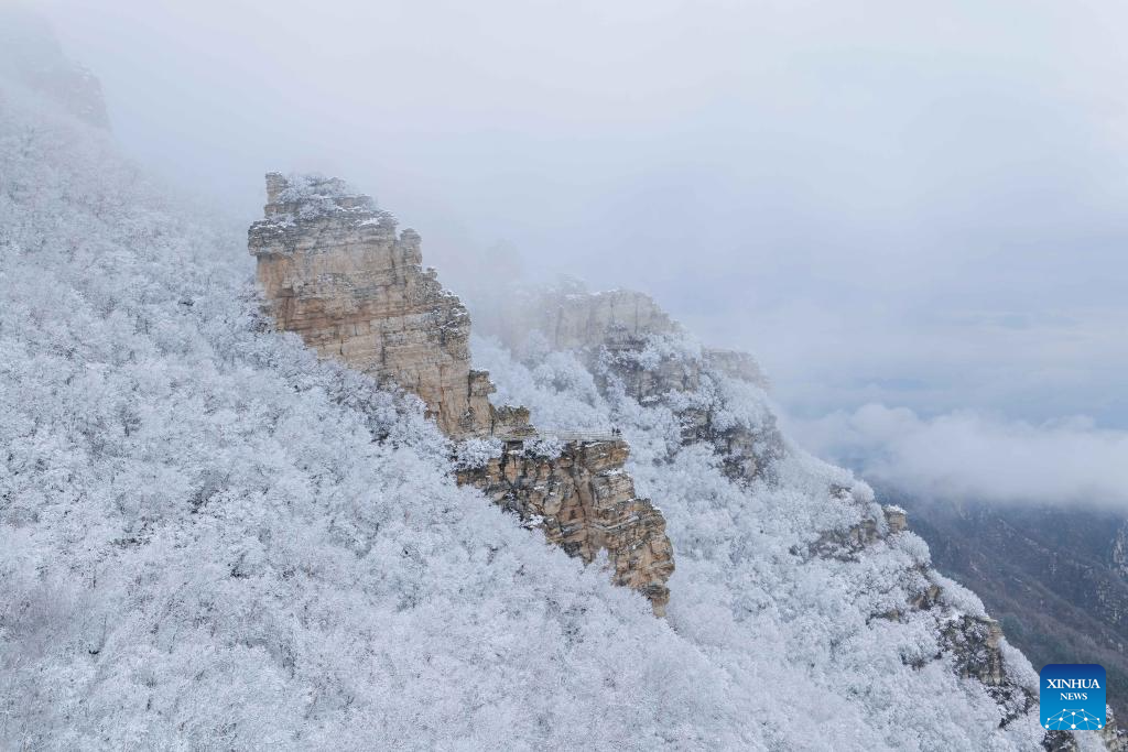 Baishi Mountain covered in snow in Laiyuan County, N China