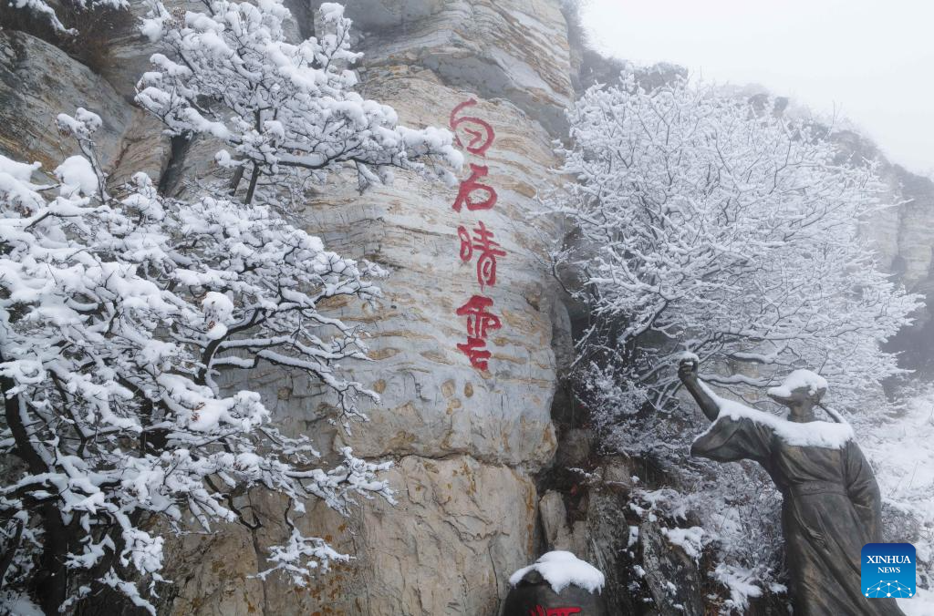 Baishi Mountain covered in snow in Laiyuan County, N China