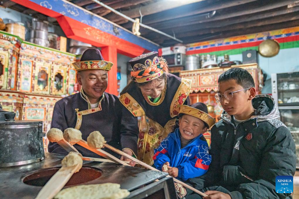 Family celebrates Gongbo New Year in Suosong Village, Xizang