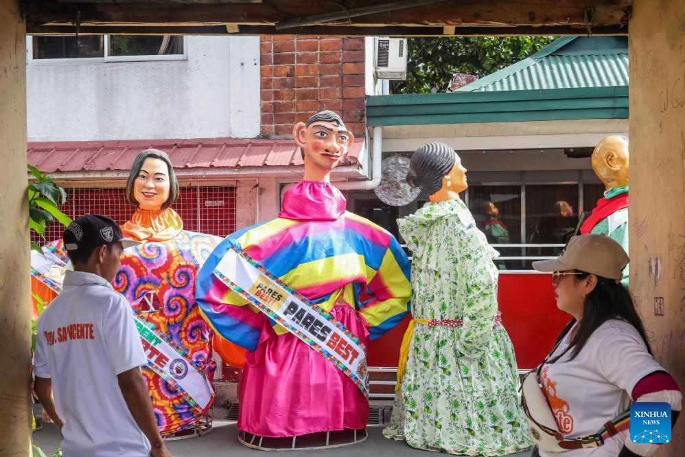 Papier-mache puppets paraded to celebrate Higantes Festival in Philippines