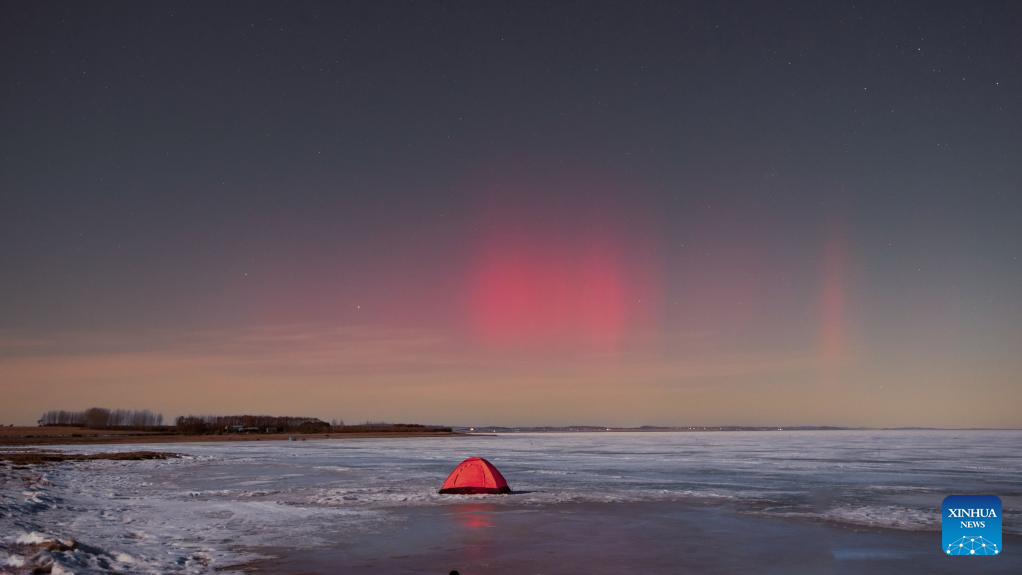 Aurora Borealis illuminates sky above Nehe City in NE China