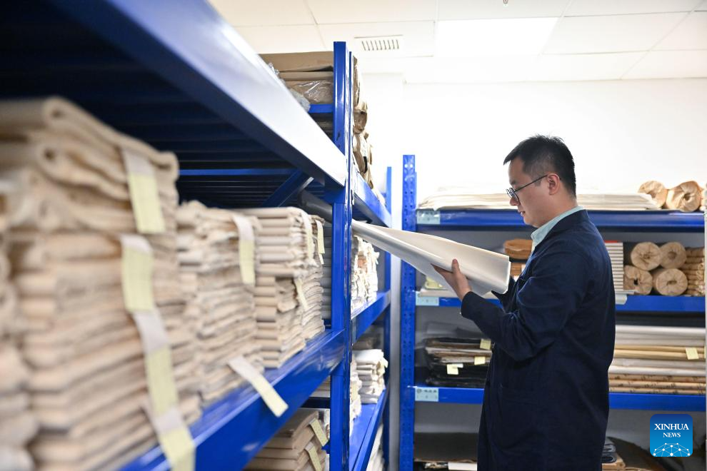 Pic story: expert dedicated to ancient book restoration