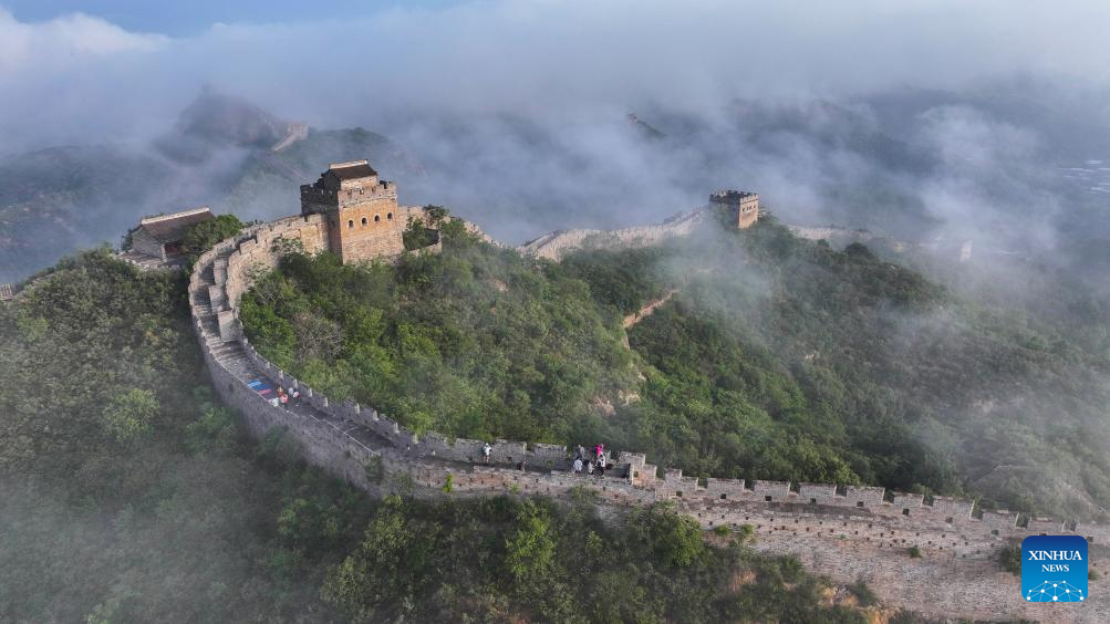 Scenery of Jinshanling section of Great Wall shrouded in clouds in Hebei