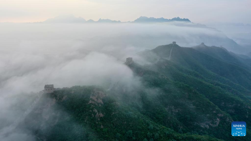 Scenery of Jinshanling section of Great Wall shrouded in clouds in Hebei