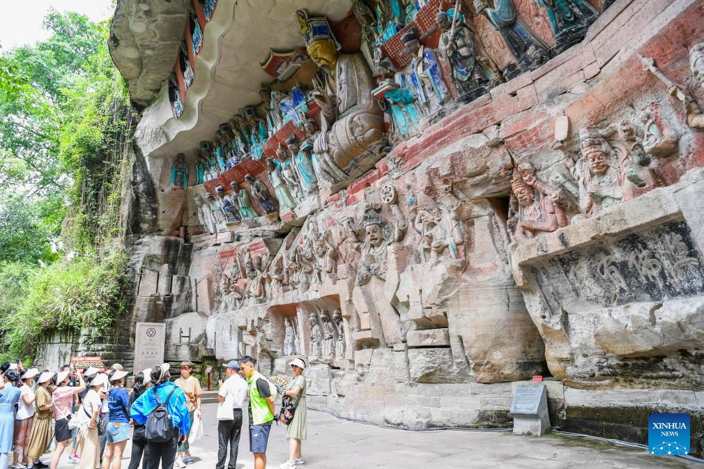 Tourists visit scenic spot of Dazu Rock Carvings in China's Chongqing