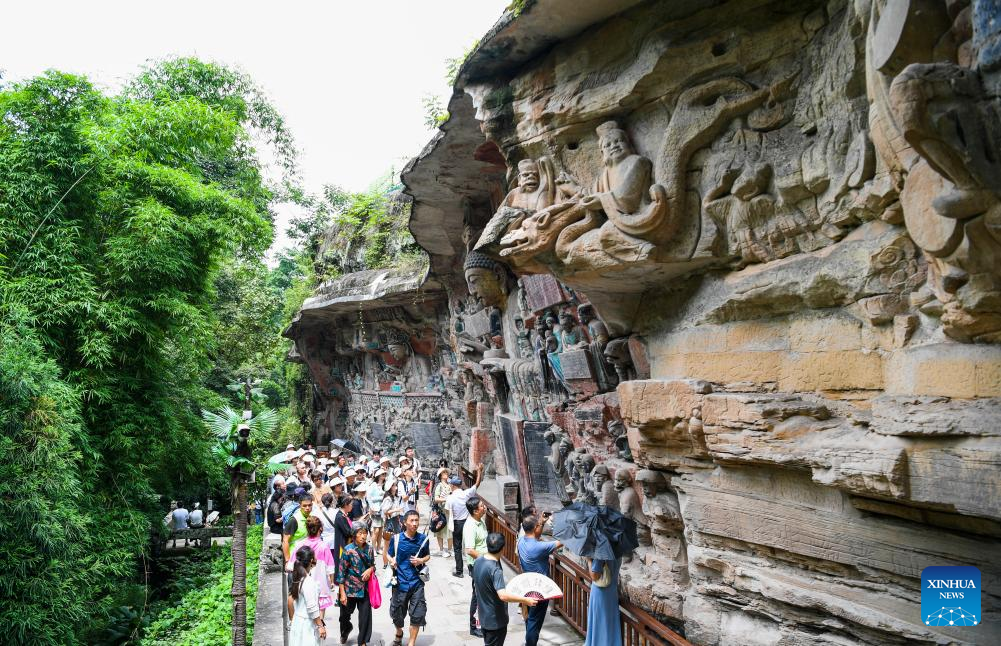 Tourists visit scenic spot of Dazu Rock Carvings in China's Chongqing